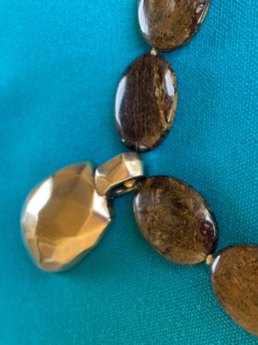 Brown stone necklace with large gold "charm"